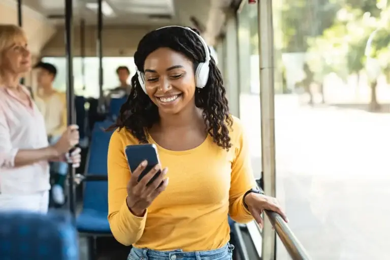 Woman Using Phone on bus